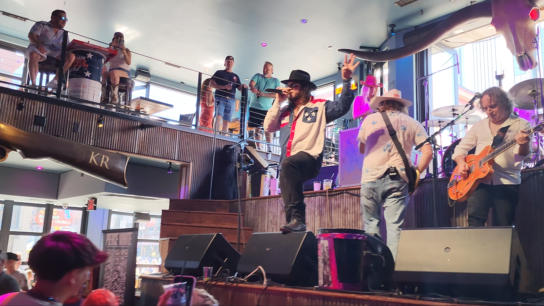 A live band performing on Broadway during the day.